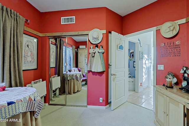 carpeted bedroom with a closet