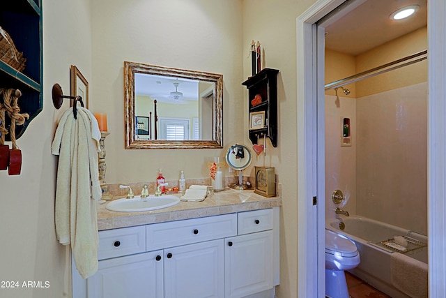 full bathroom with toilet, vanity, and shower / bathtub combination