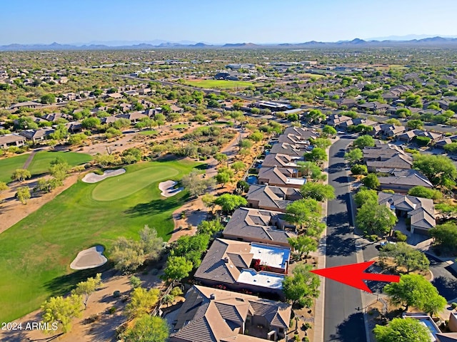 birds eye view of property with a mountain view