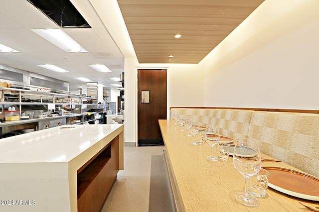 kitchen featuring wooden ceiling and a kitchen island