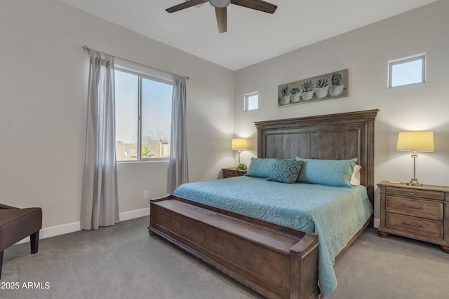 bedroom with a ceiling fan, carpet flooring, and baseboards