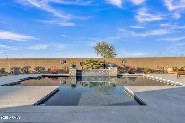 view of swimming pool with a patio area, a fenced backyard, and a fenced in pool