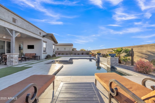 view of swimming pool featuring a fenced backyard, an outdoor living space, a fenced in pool, and a patio