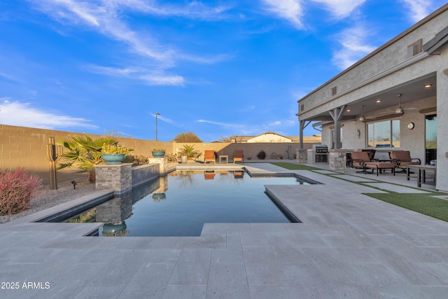 view of swimming pool with a fenced backyard, a grill, area for grilling, and a patio