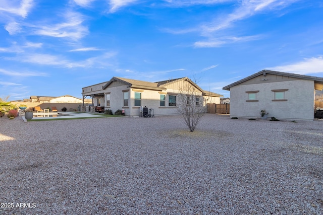 rear view of property with fence