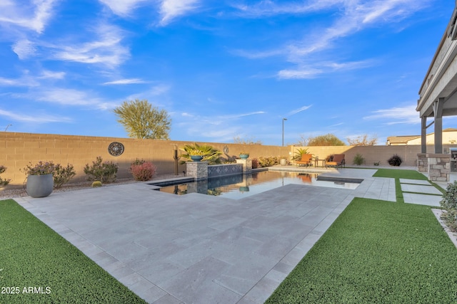 view of patio / terrace featuring a fenced backyard and a fenced in pool