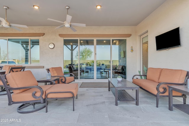 view of patio featuring ceiling fan and an outdoor living space