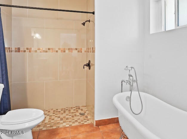 bathroom with tile patterned flooring, toilet, and shower with separate bathtub