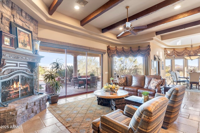 15956 E Tombstone Trl, Fountain Hills, AZ 85268 - living area with stone tile floors, plenty of natural light, visible vents, and a large fireplace
