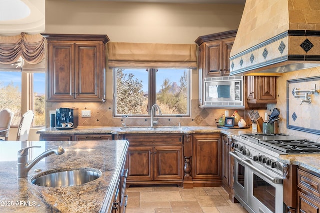 15956 E Tombstone Trl, Fountain Hills, AZ 85268 - kitchen with a sink, custom exhaust hood, stone tile flooring, and stainless steel appliances