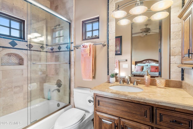 15956 E Tombstone Trl, Fountain Hills, AZ 85268 - bathroom with toilet, connected bathroom, enclosed tub / shower combo, ceiling fan, and vanity