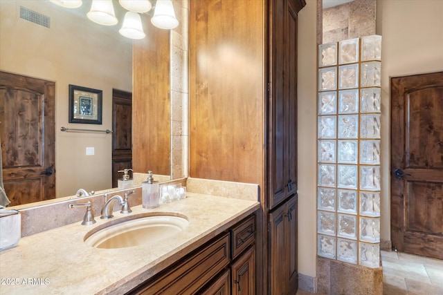 15956 E Tombstone Trl, Fountain Hills, AZ 85268 - bathroom with vanity, stone finish floor, and visible vents