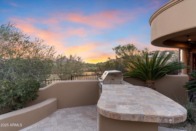 15956 E Tombstone Trl, Fountain Hills, AZ 85268 - patio terrace at dusk featuring area for grilling and a ceiling fan