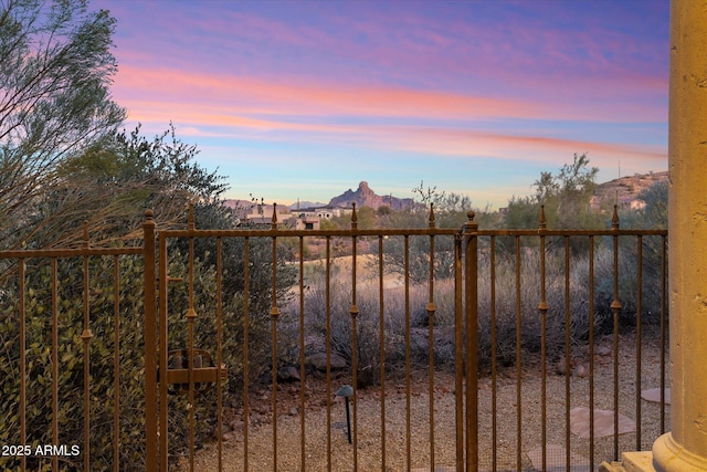 15956 E Tombstone Trl, Fountain Hills, AZ 85268 - gate at dusk featuring a mountain view