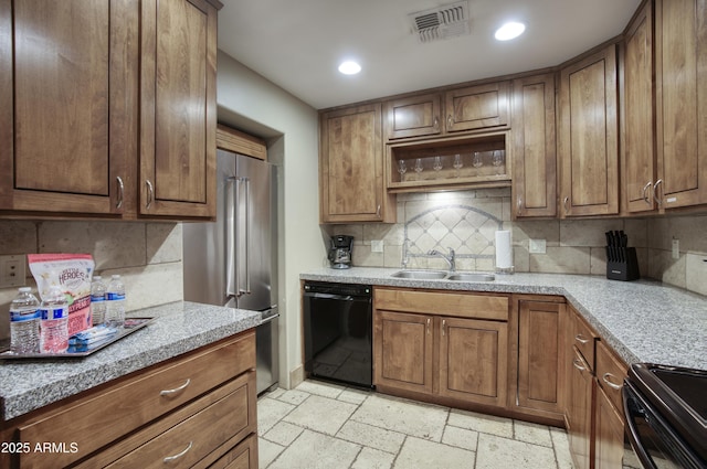 4008 N 85th St, Scottsdale, AZ 85251 - kitchen with black dishwasher, a sink, electric stove, stone tile floors, and recessed lighting