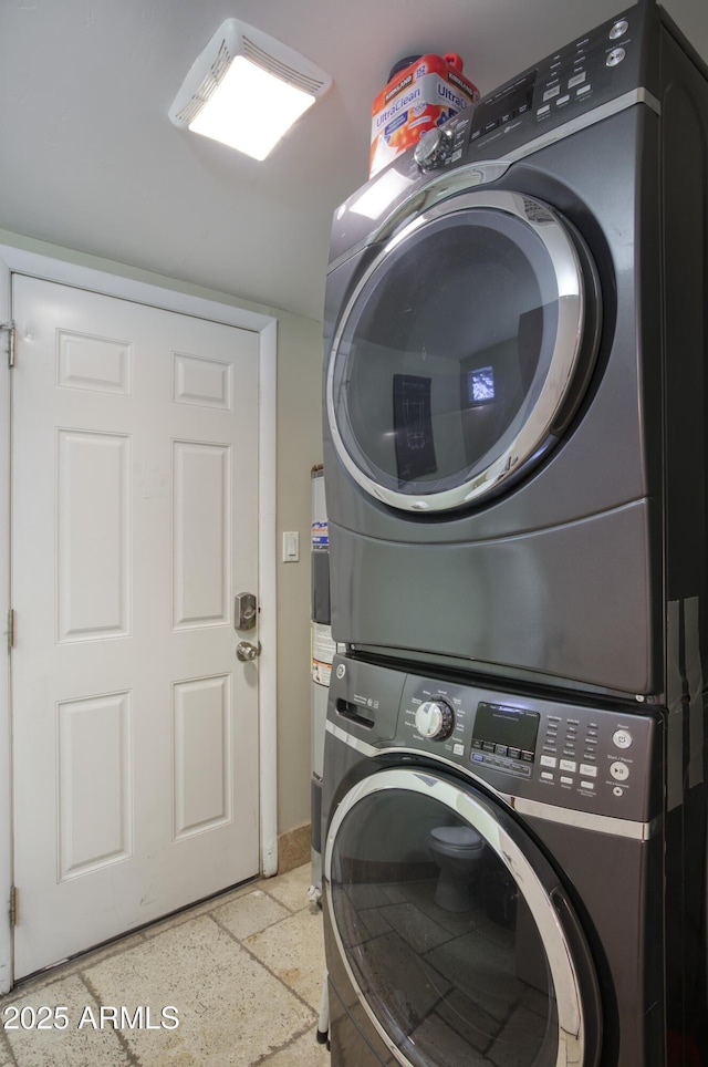 4008 N 85th St, Scottsdale, AZ 85251 - washroom featuring stacked washer and clothes dryer and baseboards