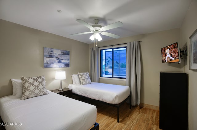 4008 N 85th St, Scottsdale, AZ 85251 - bedroom with light wood-style floors, baseboards, and a ceiling fan