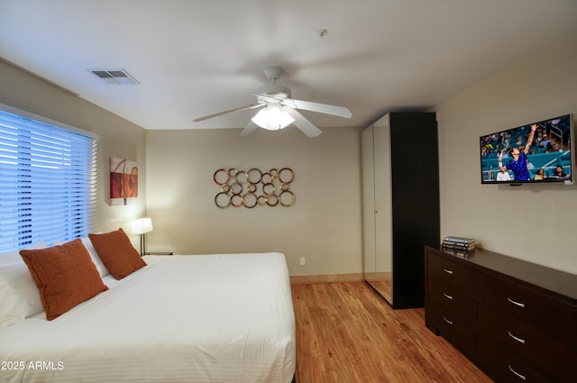 4008 N 85th St, Scottsdale, AZ 85251 - bedroom with light wood-style floors, ceiling fan, and baseboards