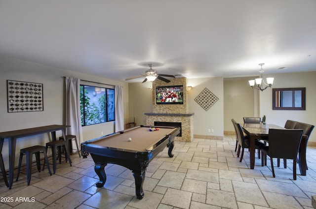 4008 N 85th St, Scottsdale, AZ 85251 - recreation room with stone tile flooring, a chandelier, a fireplace, pool table, and a ceiling fan