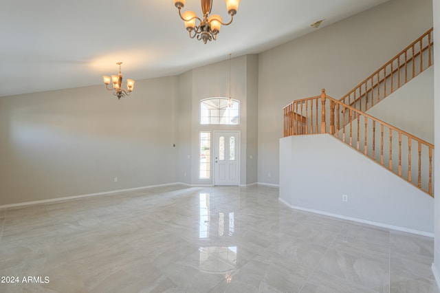 interior space with a chandelier and a high ceiling