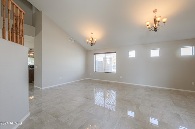 unfurnished room featuring high vaulted ceiling and an inviting chandelier