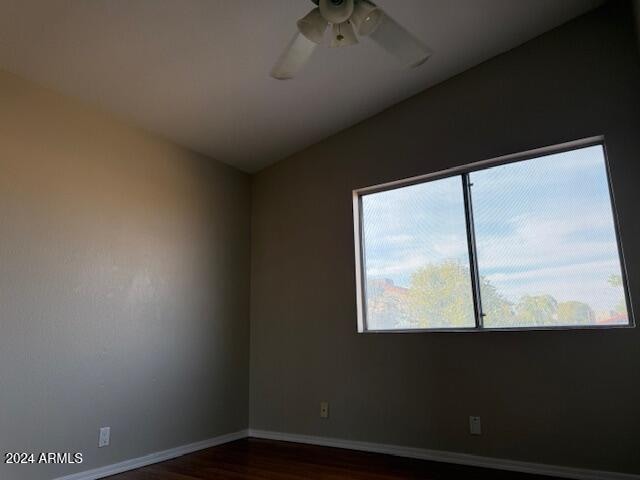 empty room featuring dark hardwood / wood-style floors and ceiling fan