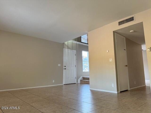 spare room with light tile patterned floors