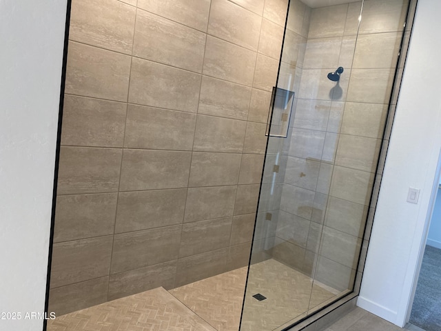 full bath with a tile shower