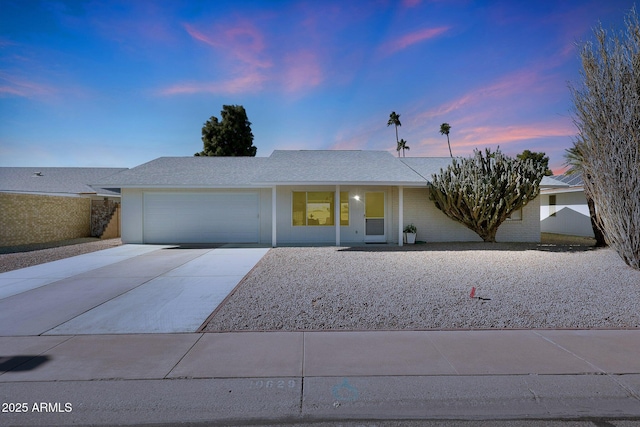 ranch-style home featuring a garage