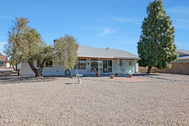 back of property featuring a patio