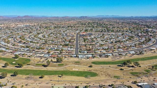 birds eye view of property with a mountain view