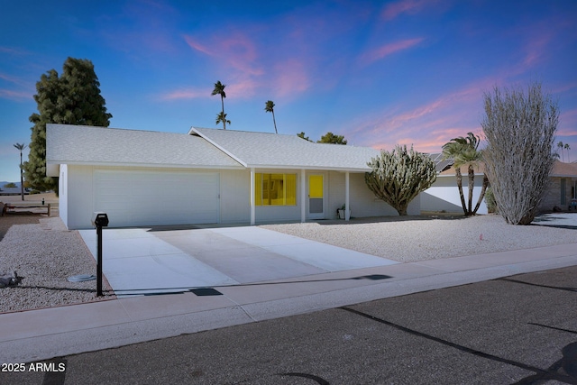 ranch-style house featuring a garage