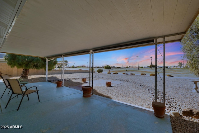 view of patio terrace at dusk