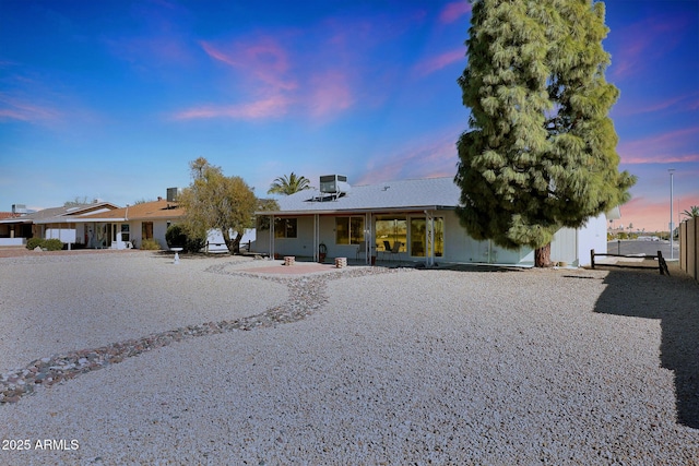 ranch-style home with a patio