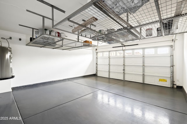 garage with electric water heater and baseboards