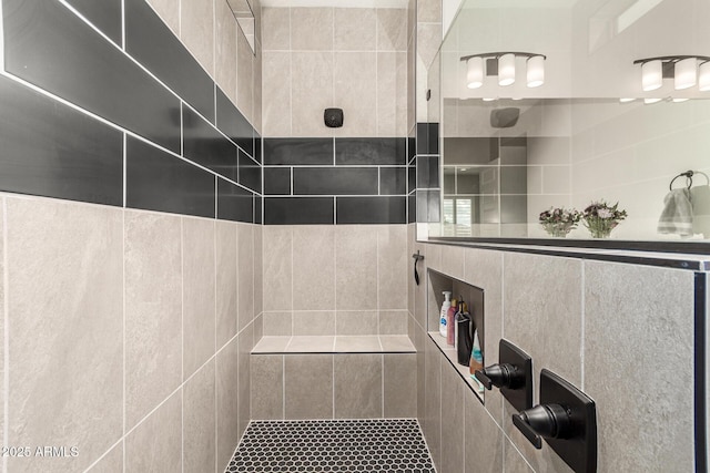 full bathroom with a tile shower