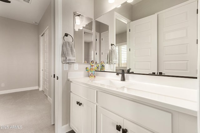 bathroom featuring vanity and baseboards