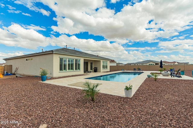 view of swimming pool featuring a fenced in pool, a fenced backyard, and a patio area