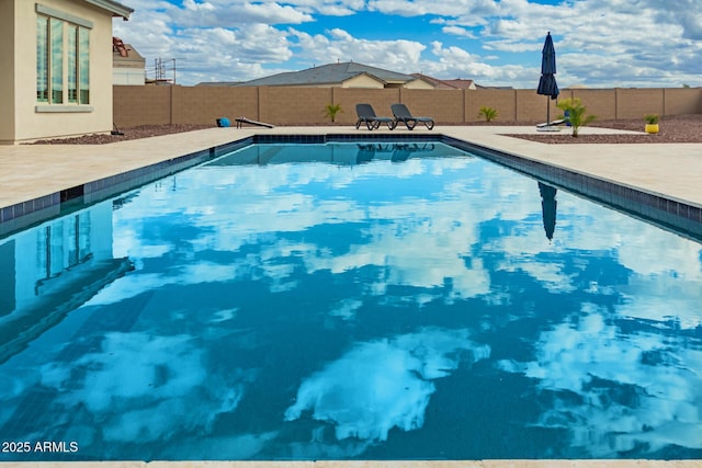 view of pool with a fenced in pool, a patio, and a fenced backyard