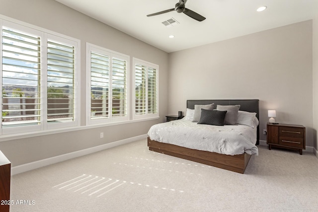 bedroom featuring visible vents, carpet, and baseboards