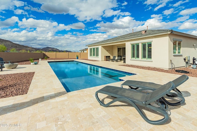 view of swimming pool with a fenced in pool, a fenced backyard, and a patio area