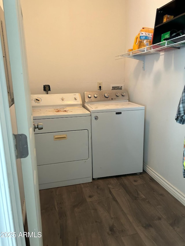 laundry area featuring dark wood-type flooring and separate washer and dryer