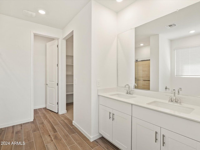 bathroom with hardwood / wood-style floors and vanity