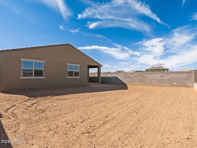 view of side of property with a patio