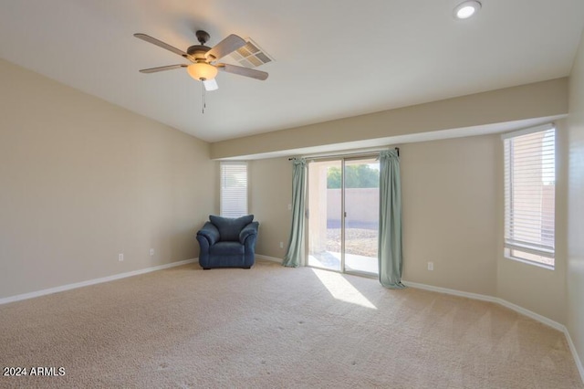 unfurnished room with light carpet and ceiling fan