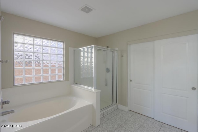 bathroom featuring plus walk in shower