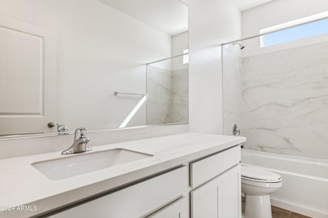 full bathroom featuring hardwood / wood-style floors, tiled shower / bath combo, toilet, and vanity