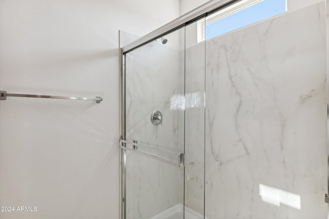 bathroom featuring an enclosed shower