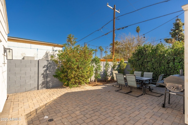 view of patio / terrace with outdoor dining area and a fenced backyard