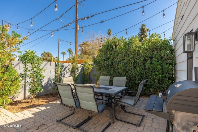 view of patio / terrace with outdoor dining space, area for grilling, and a fenced backyard